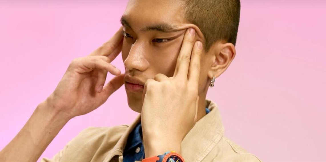 An image of the ad wherein an Asian man using his hands to forcefully make his eyes slant