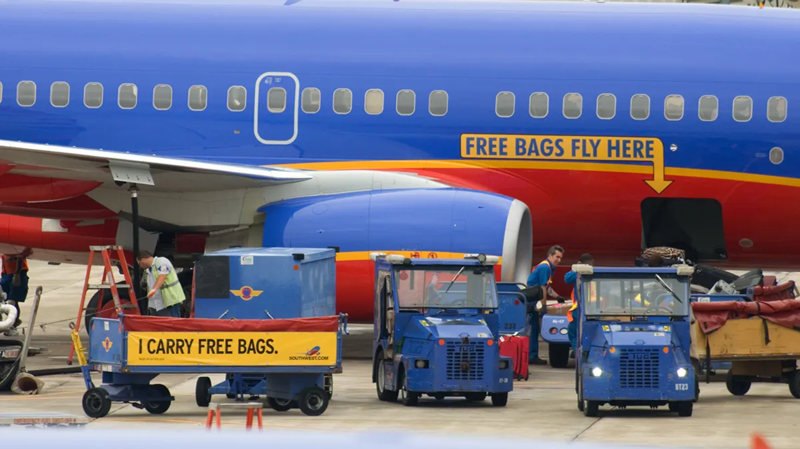 An airplane of Southwest with a painted note 