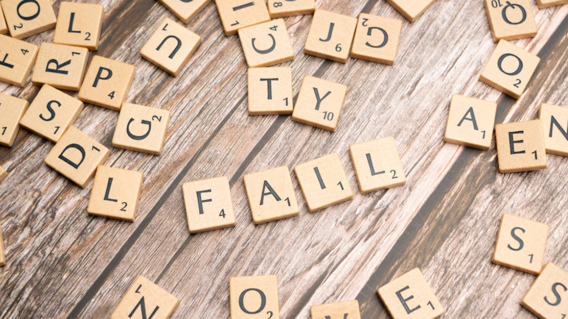 The word failure constructed using wooden scrabble letter pieces