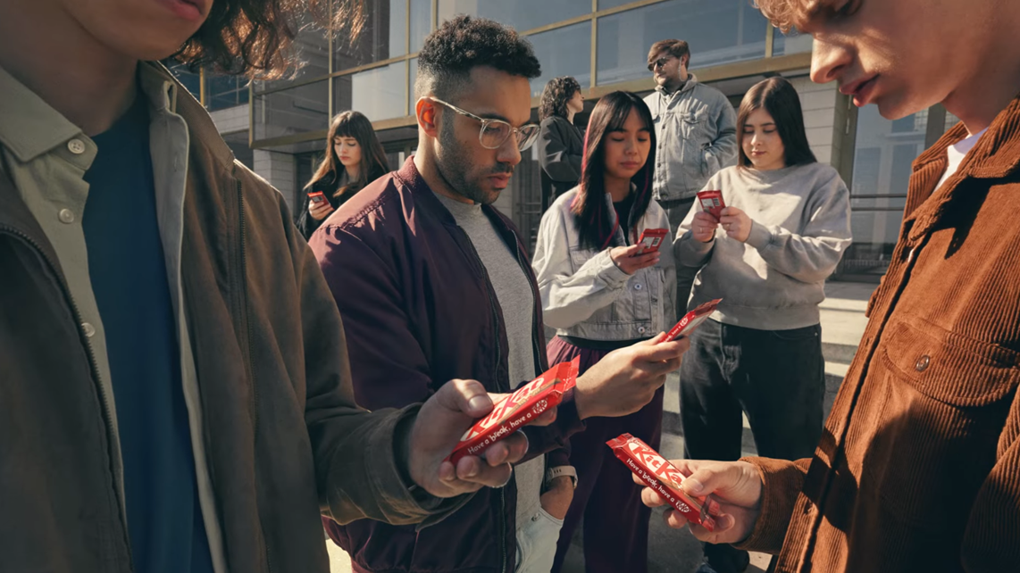 The KitKat's billboard wherein the phones of the people using them were replaced by KitKat chocolates