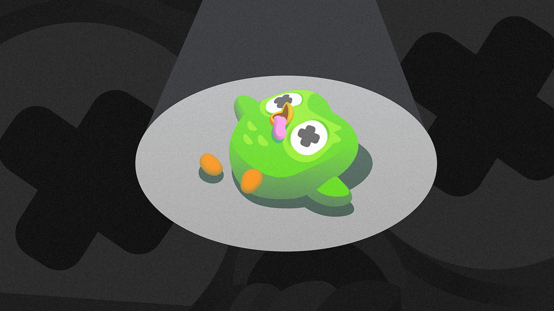 An image of Duo, the Duolingo mascot, lying in the ground and looks dead