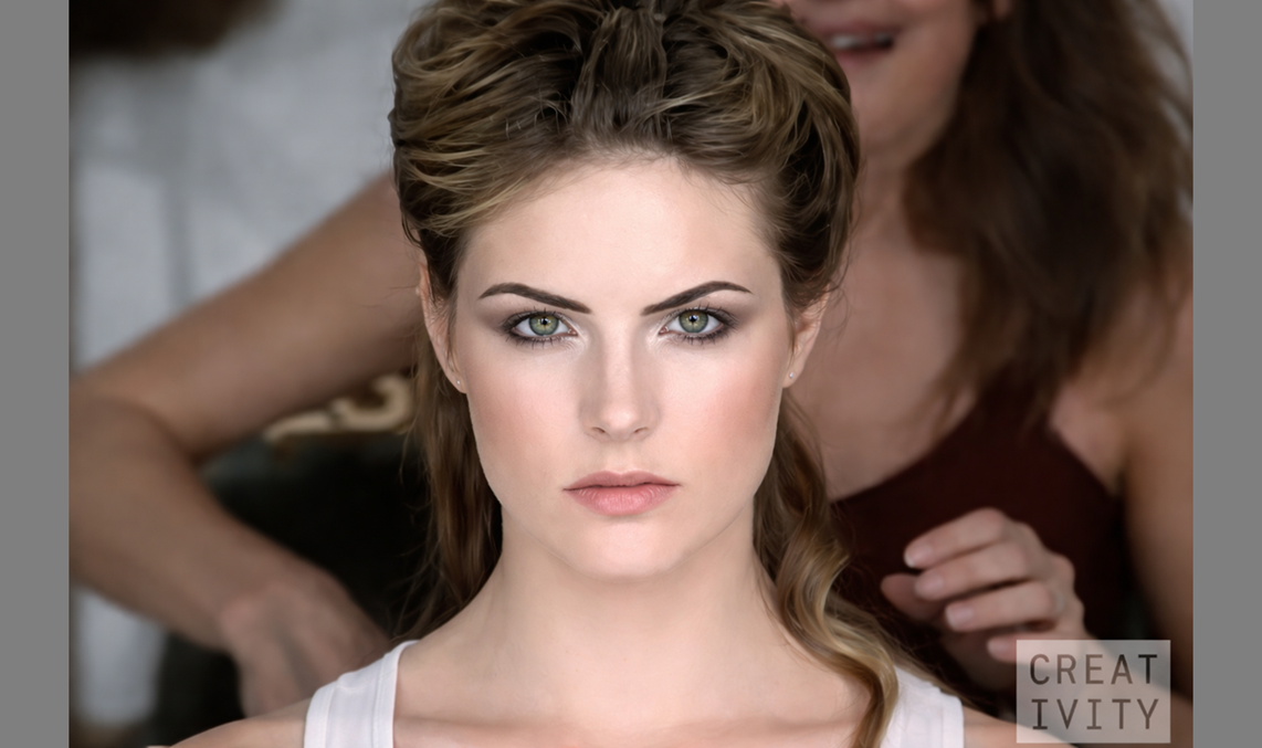 An image from the video wherein a woman having a makeover